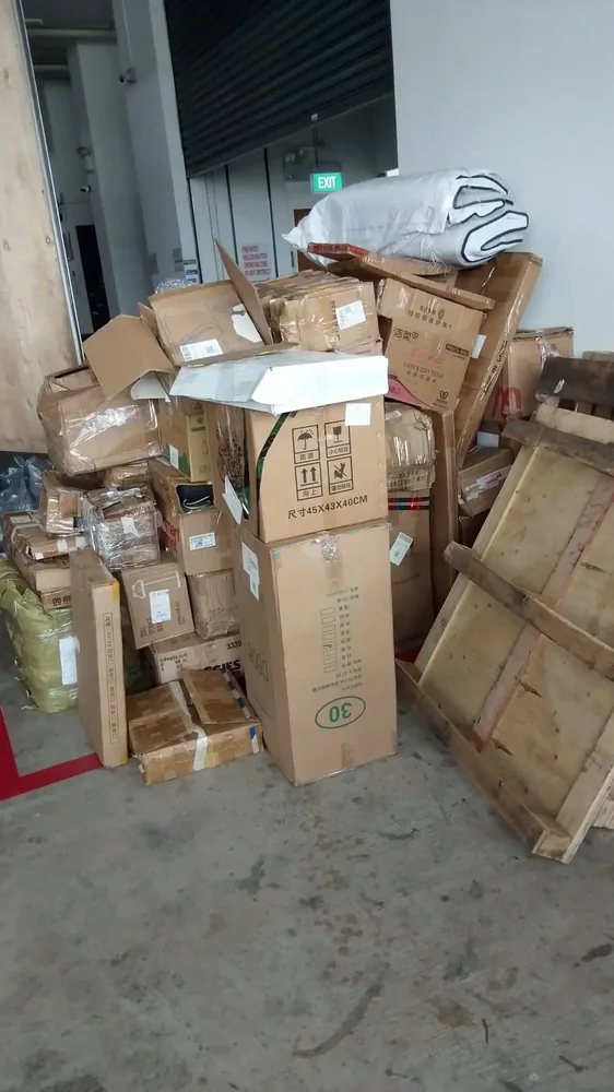 Boxes and discarded household items from a Smiley Express collection
